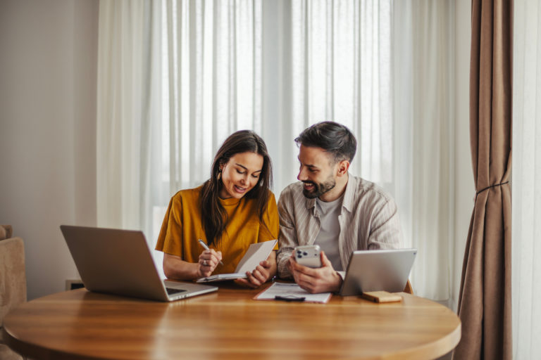 Couple planning finances and budget in home office