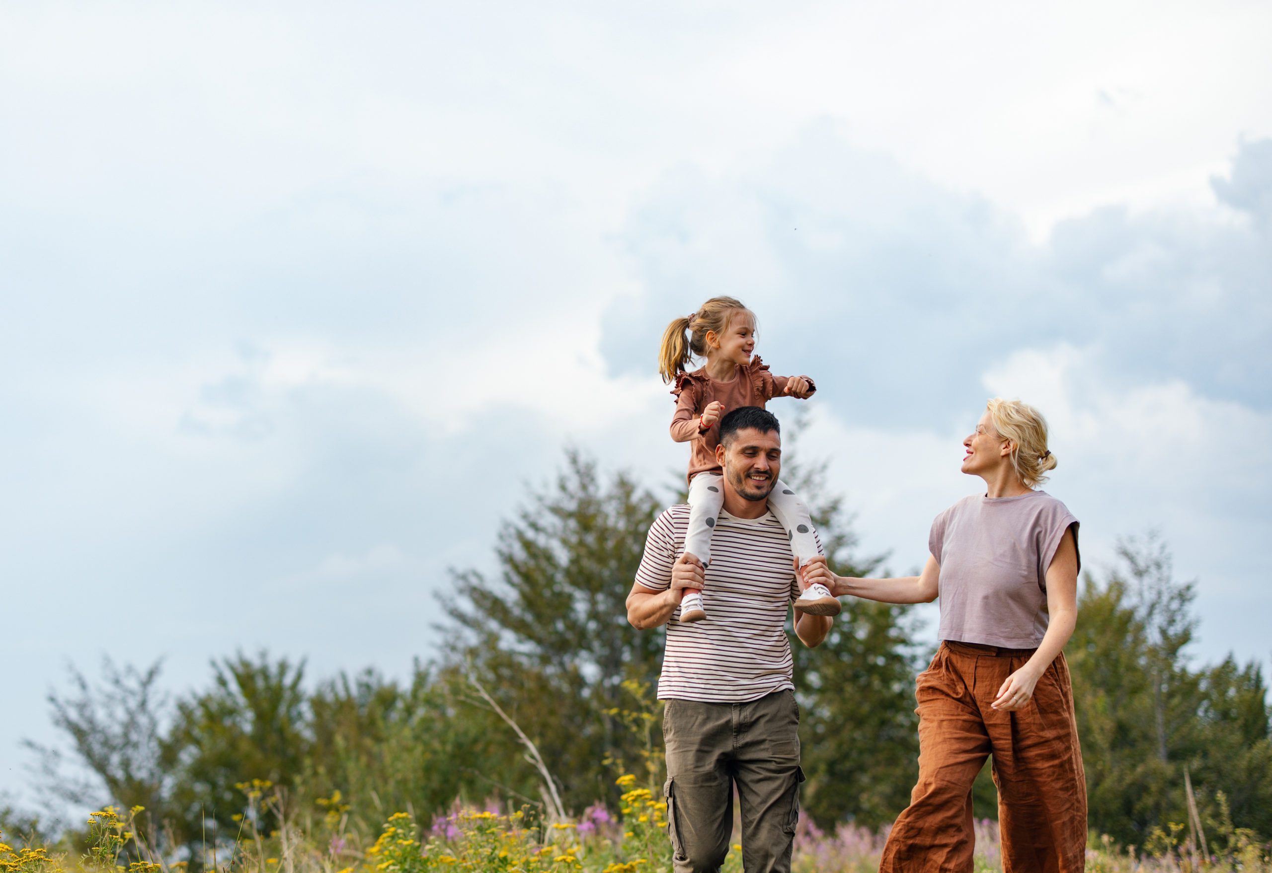 Happy Family Enjoying a Nature Walk in the Countryside