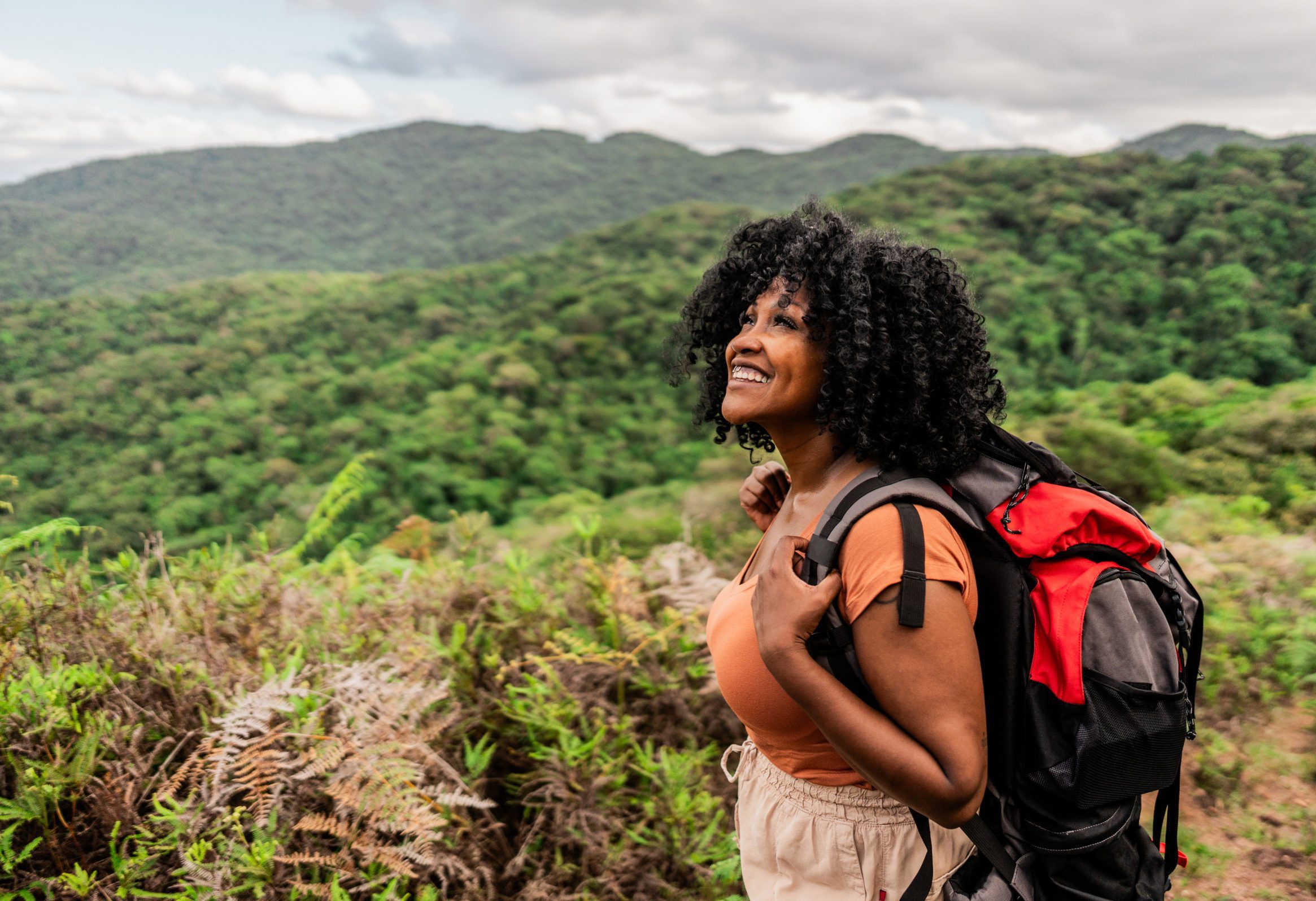 Mid adult woman hiking on mountain