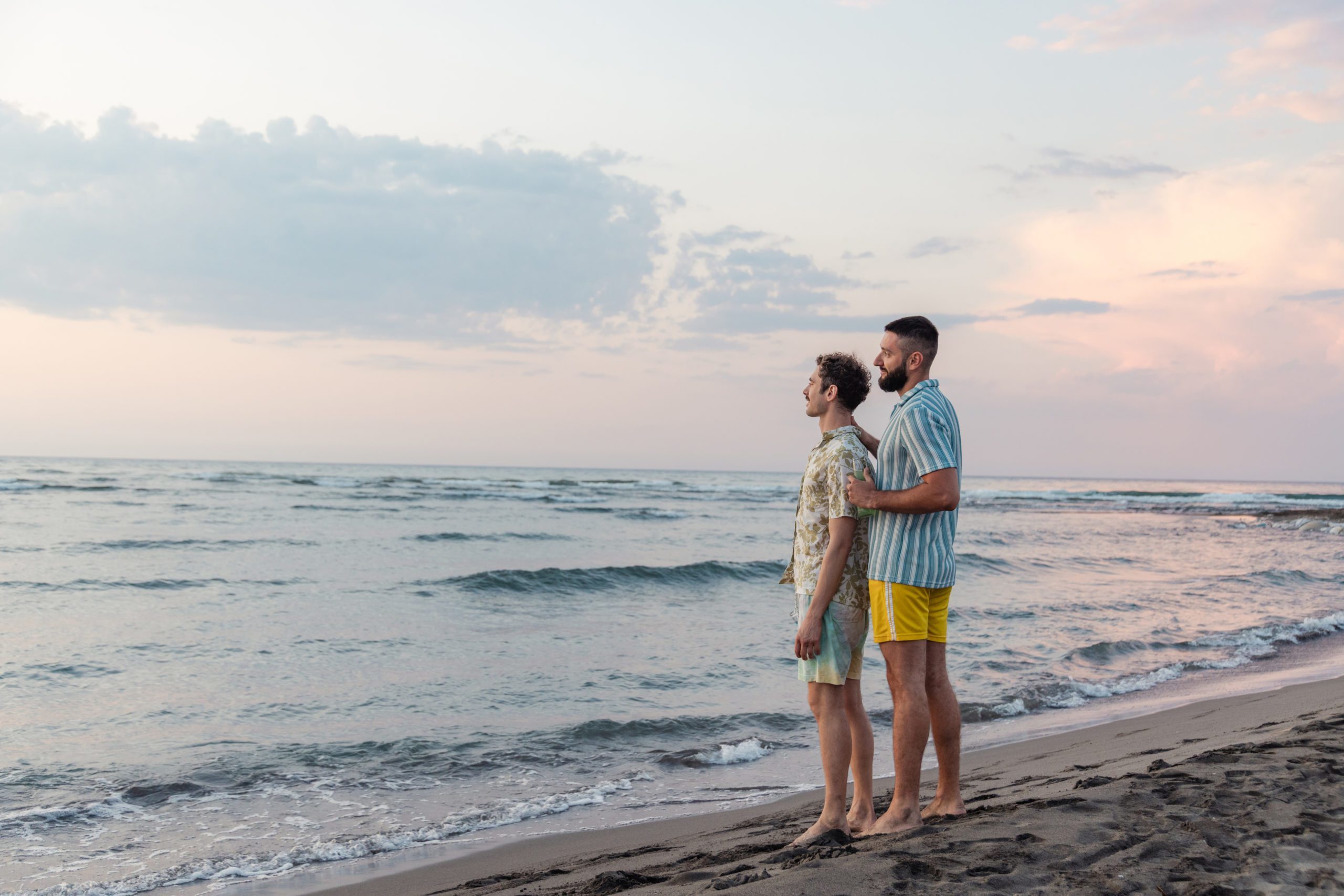 Two men enjoying a romantic moment together at the seaside