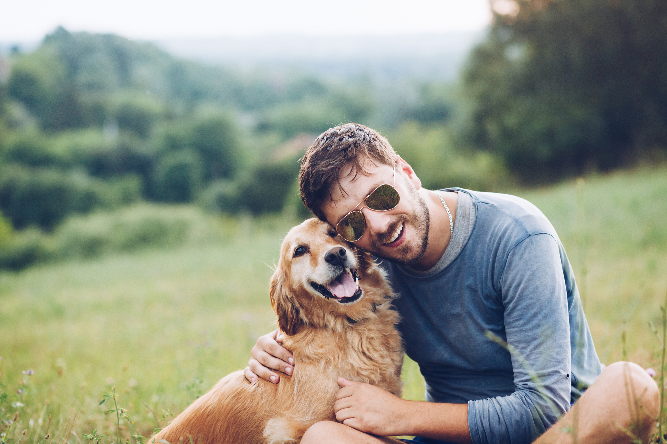 Happy man outdoors with his dog